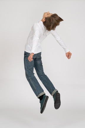 Young man in casual clothes jumping