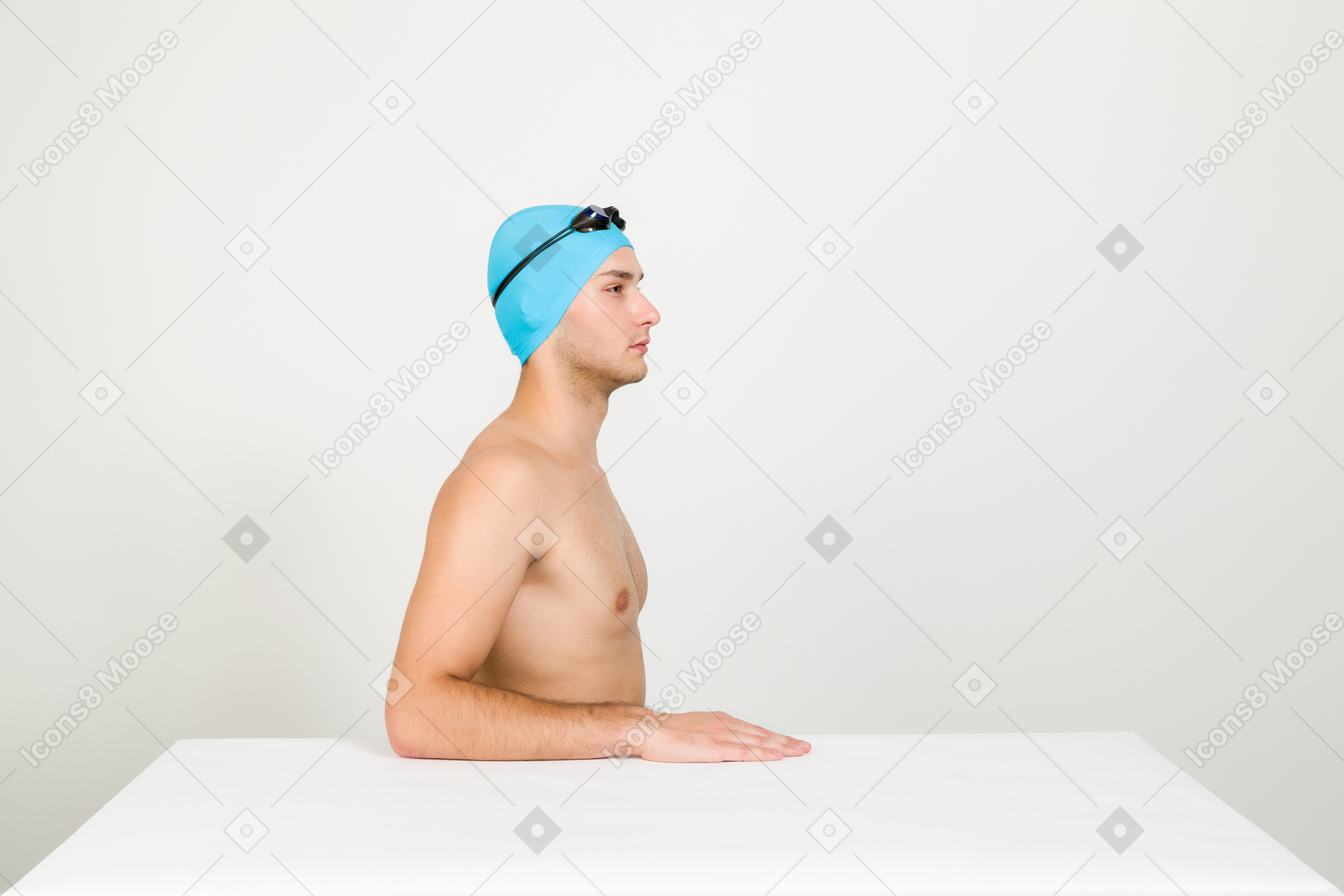 Bare chested swimmer sitting sideways