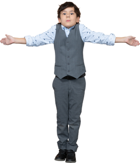Front view of a boy in grey suit standing with outstretched arms