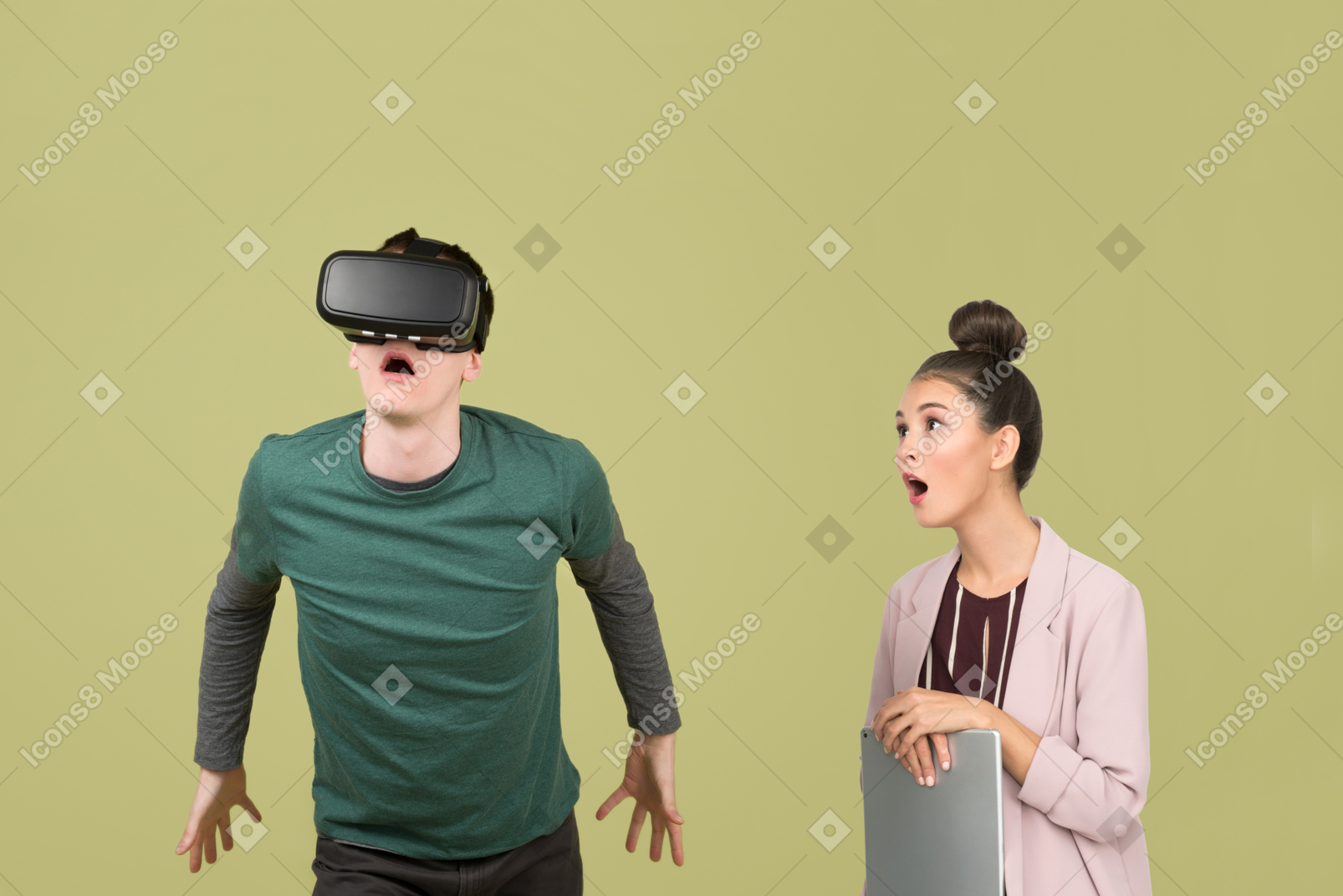 Surprised young woman looking at guy using vr glasses