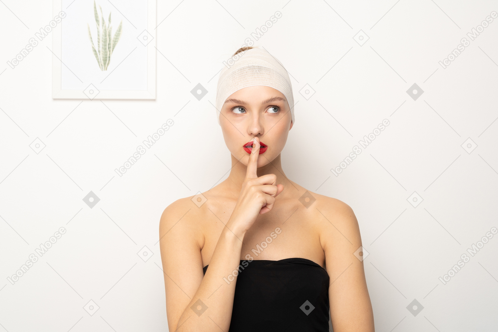 Young woman making silence gesture