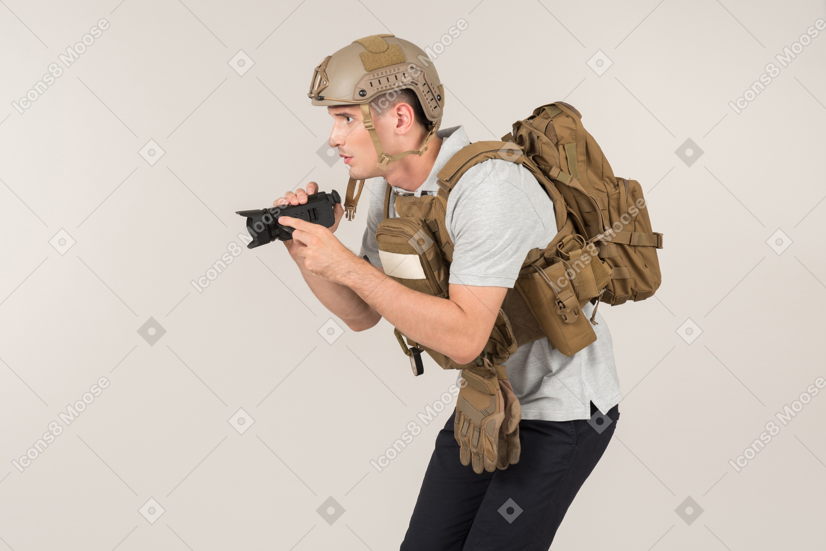 Male hot zone journalist in bulletproof vest hunting for a shot