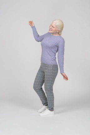 Woman dancing and waving arms
