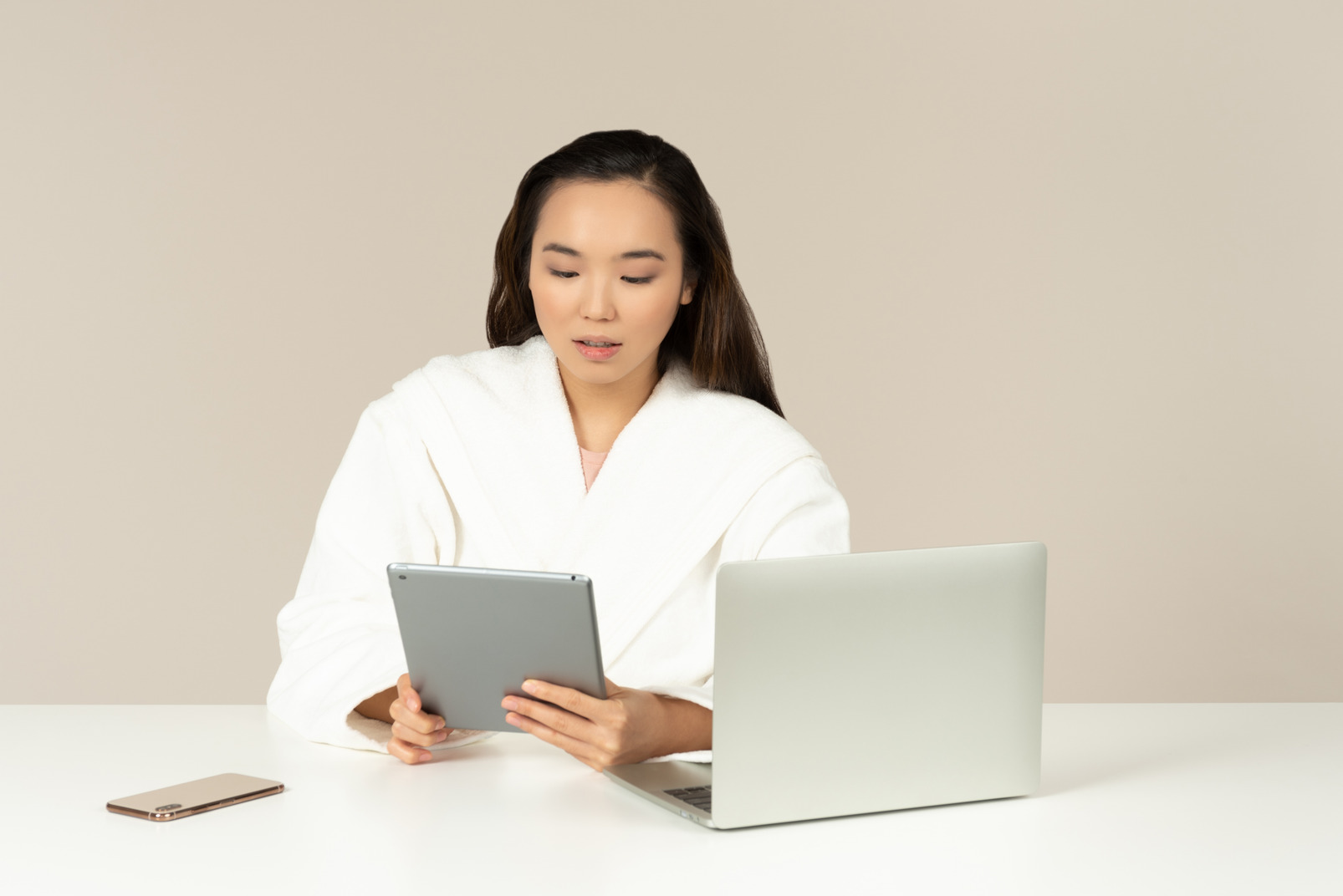 Young asian woman holding tablet and doing online shopping