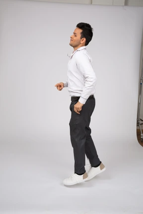 Man in white shirt walking