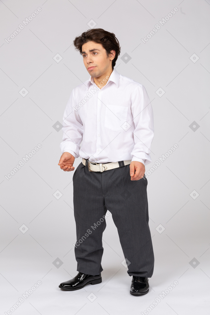 Young man in business casual clothes looking upwards