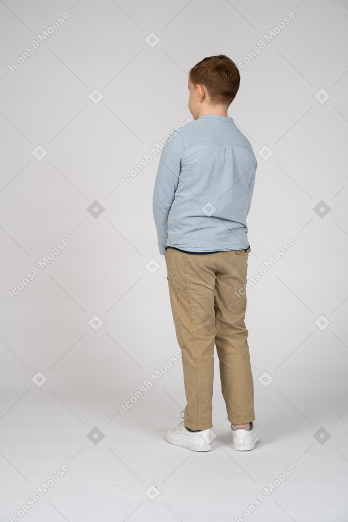Rear view of a shy boy