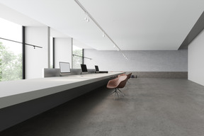 An empty office room with natural light and naked walls