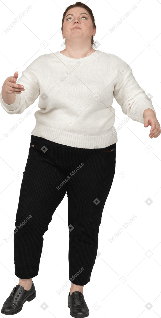Front view of a plus size woman in casual clothes making faces