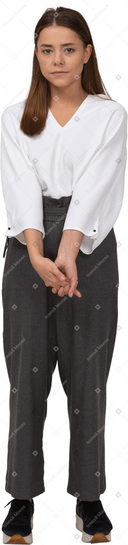 Front view of a young lady in office clothing holding hands together