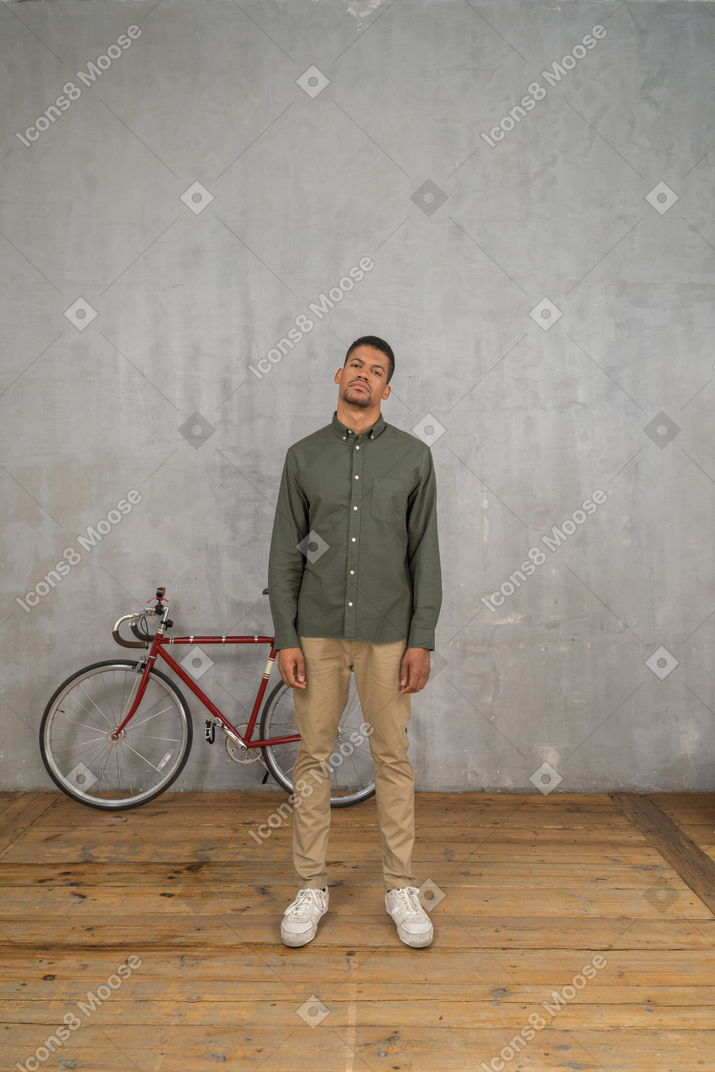 Serious man with bicycle