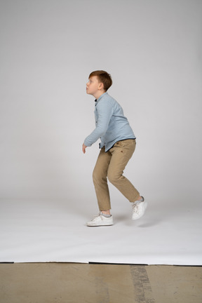 Side view of a teenager running