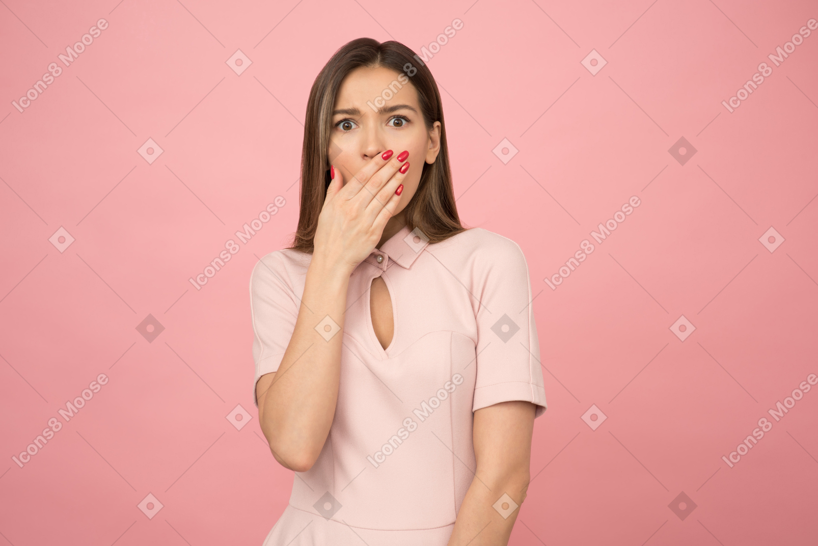 Girl with expression of shock on her face, holding her wrist next to her mouth