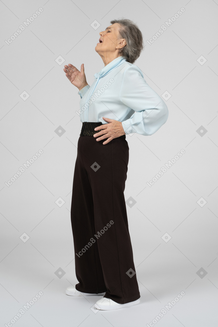 Side view of an old woman gesturing dramatically