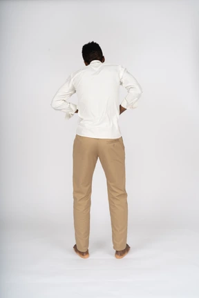 Man in white shirt standing