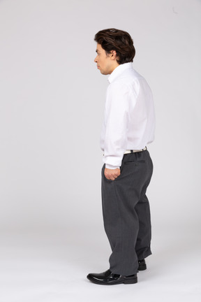 Man in business casual clothes looking away