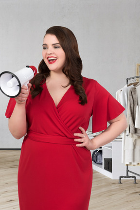 Smiling woman holding a megaphone