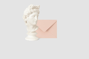 Statue bust and envelope