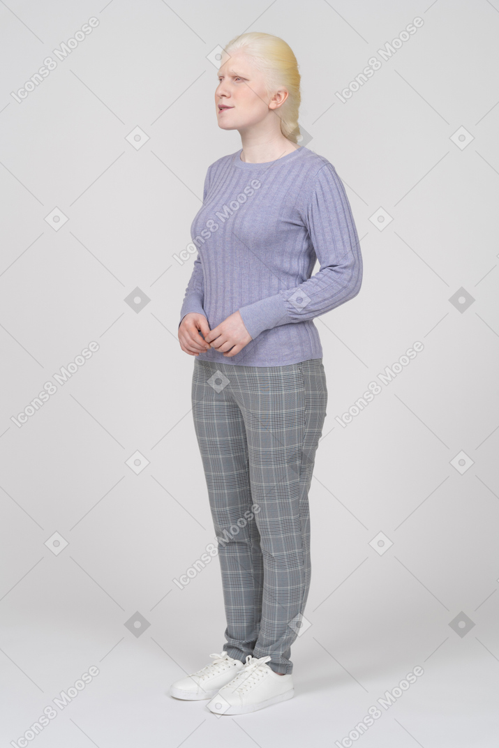 Front view of a confused woman in casual clothes