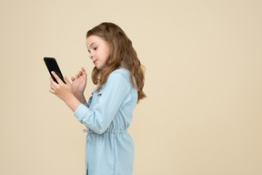 Cute little girl making a selfie