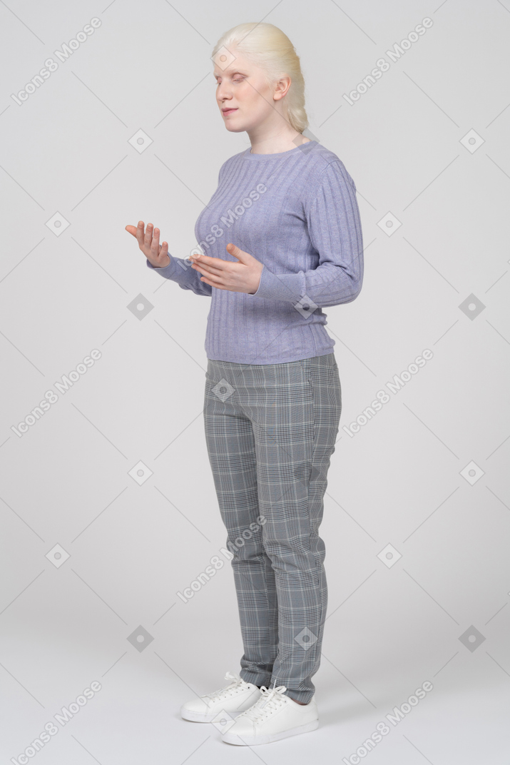 Young woman standing and explaining something