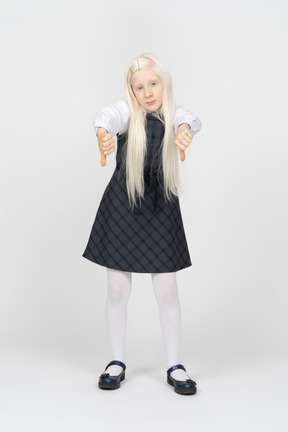 Schoolgirl with long hair showing thumbs down