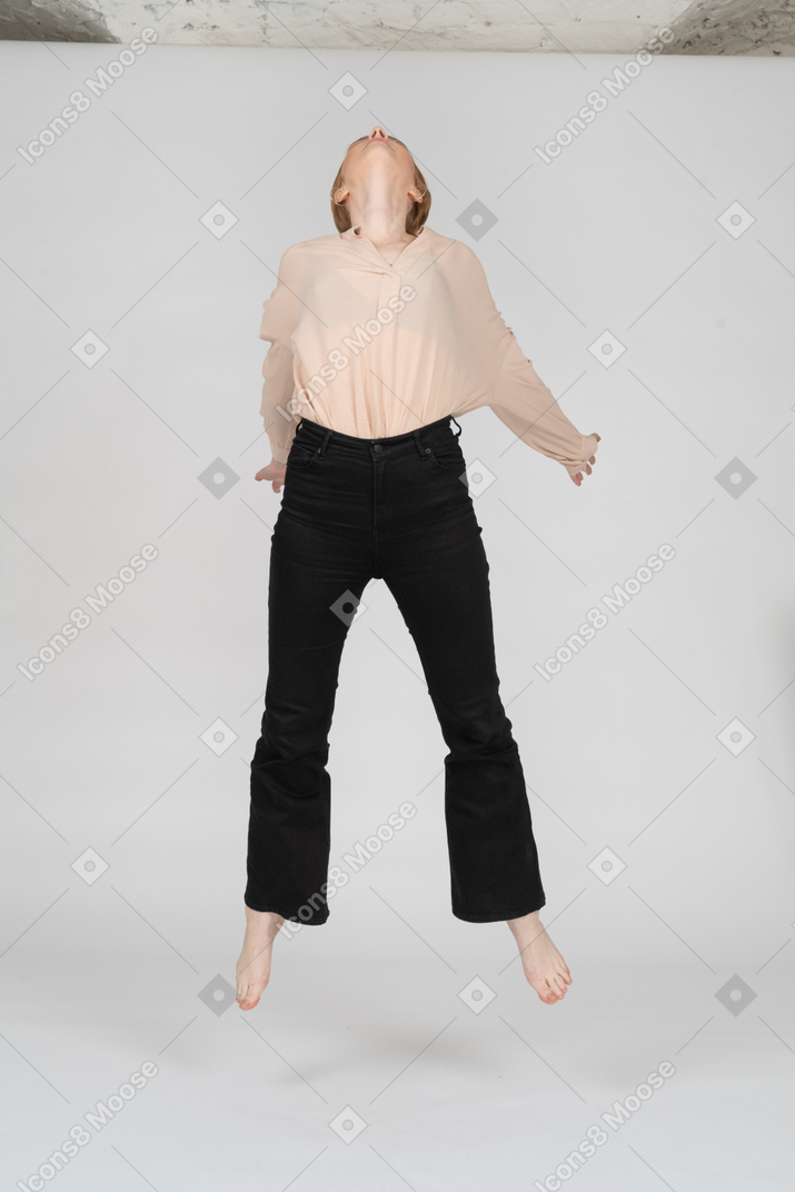 Woman in beautiful blouse jumping