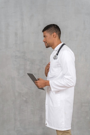 Side view of a male doctor talking