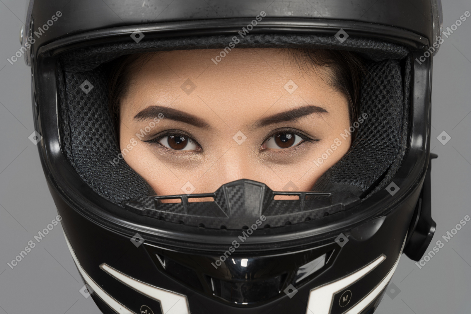 A beautiful young woman in a helmet