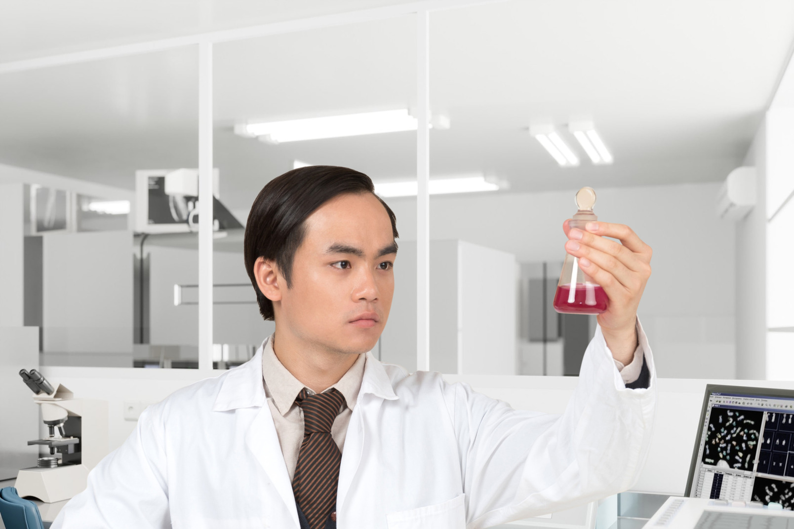 Laboratory worker looking at the test glass
