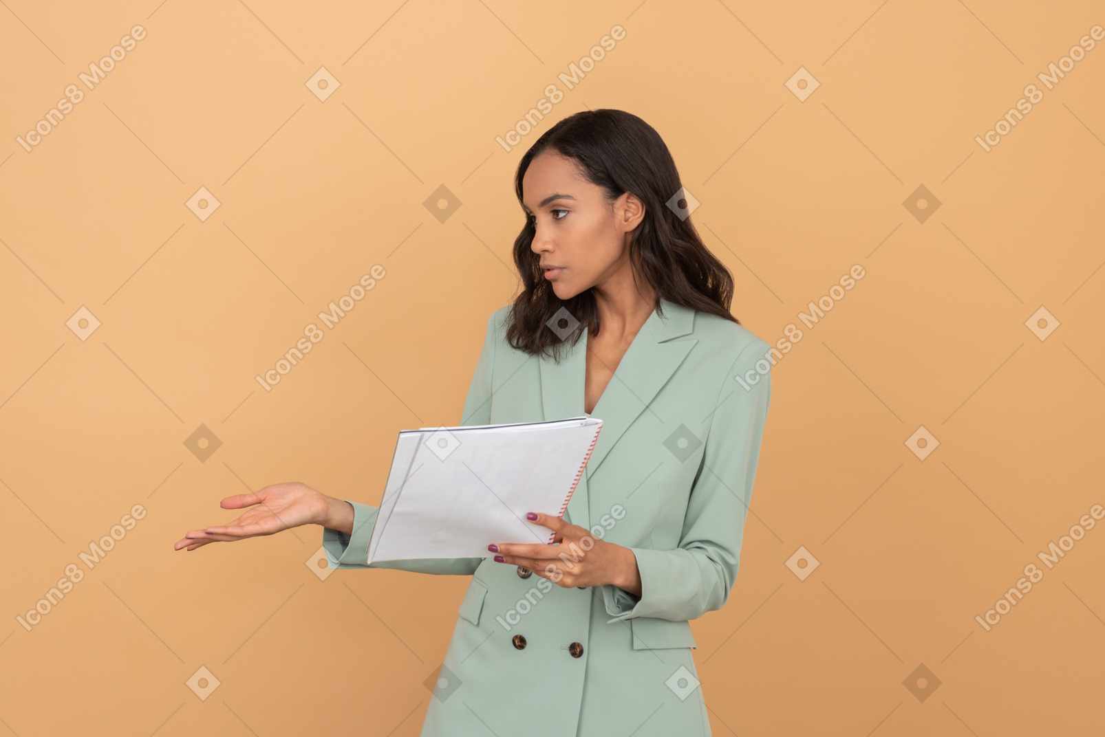 Beautiful businesswoman holding papers and propoding to take a look on it