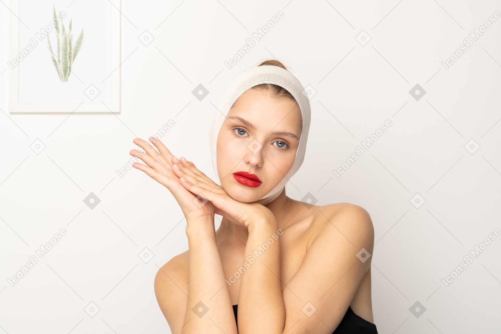 Woman with head bandage holding her hands together