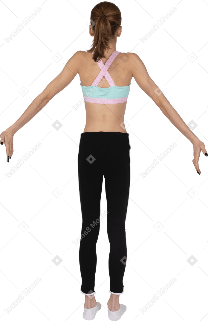Back view of a teen girl in sportswear outspreading hands
