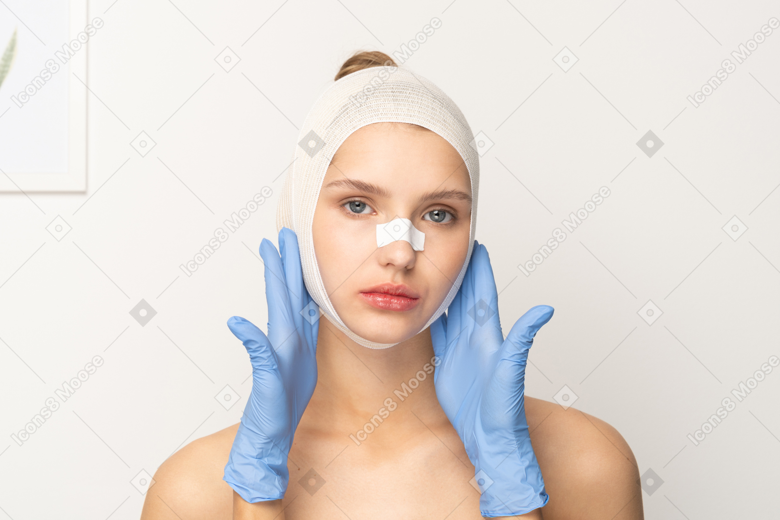 Female patient with hands holding her face