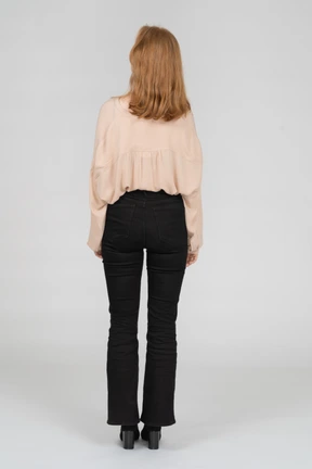 Back view of young redhead woman