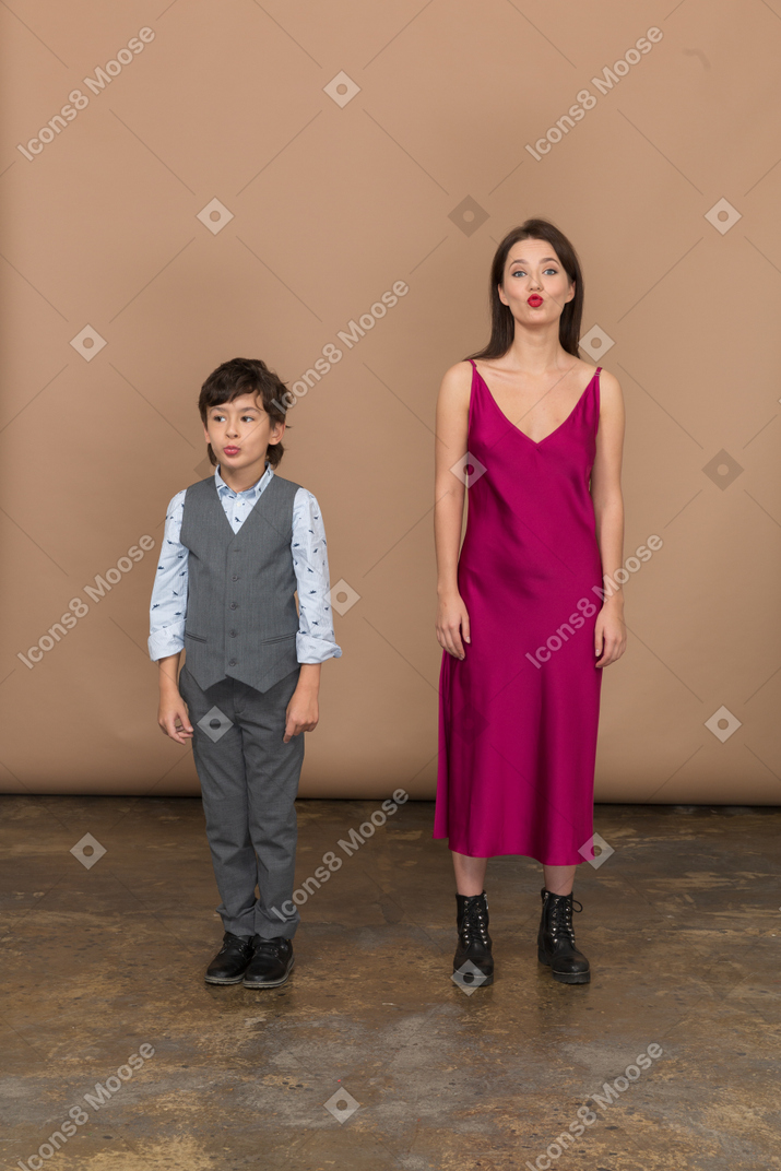 Boy and woman making funny face