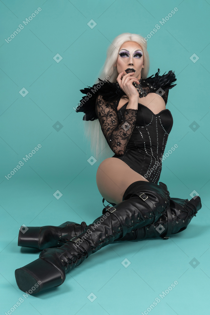 Dragqueen laying holding hand on chin