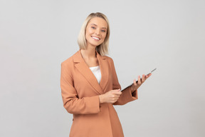 Young beautiful woman holding a digital tablet