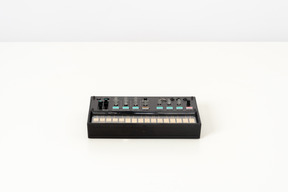 Black fm synthesizer on a white background