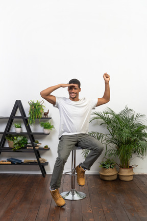 Good looking young man sitting on a chair