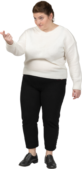 Plus size woman in casual clothes looking at camera