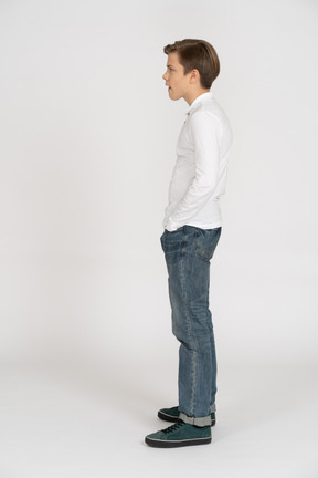 Young man in casual clothes standing