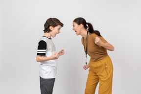 Physical education female teacher and pupil yelling at each other