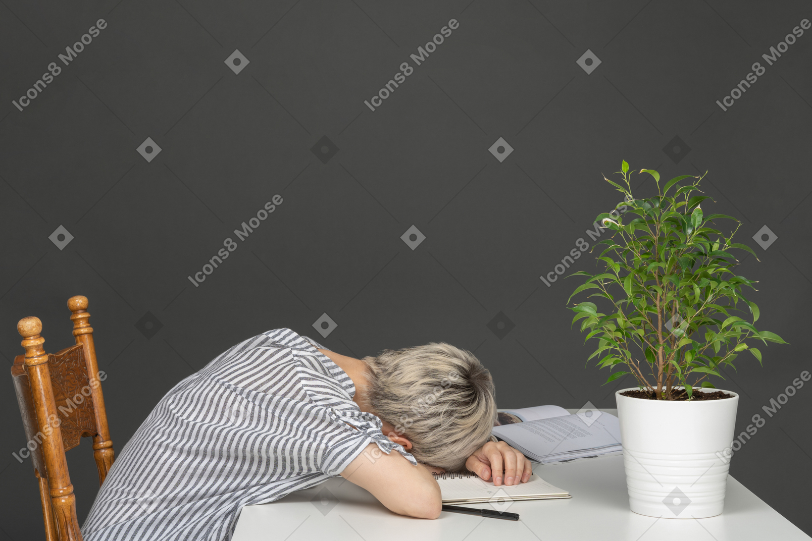 Woman at the table tired after work