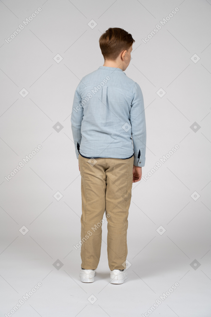 Rear view of a boy in casual clothes