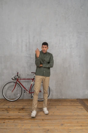 Front view of a man gesturing in confusion