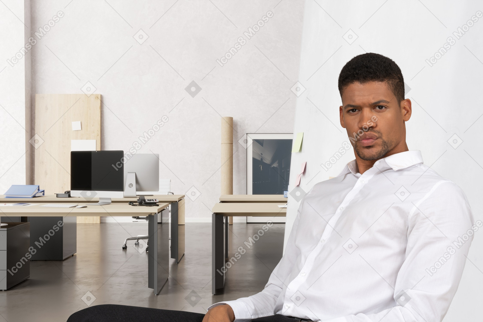 A man sitting on a chair in an office
