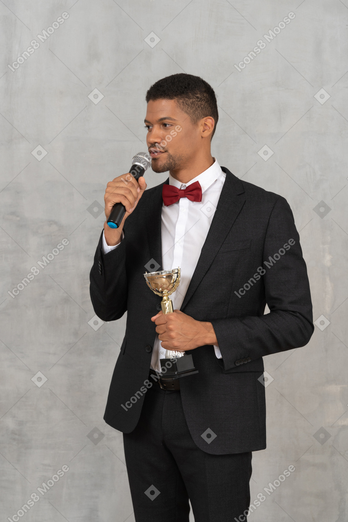 Man in suit accepting an award