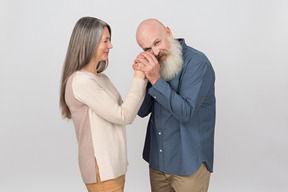 Elegant senior couple standing together