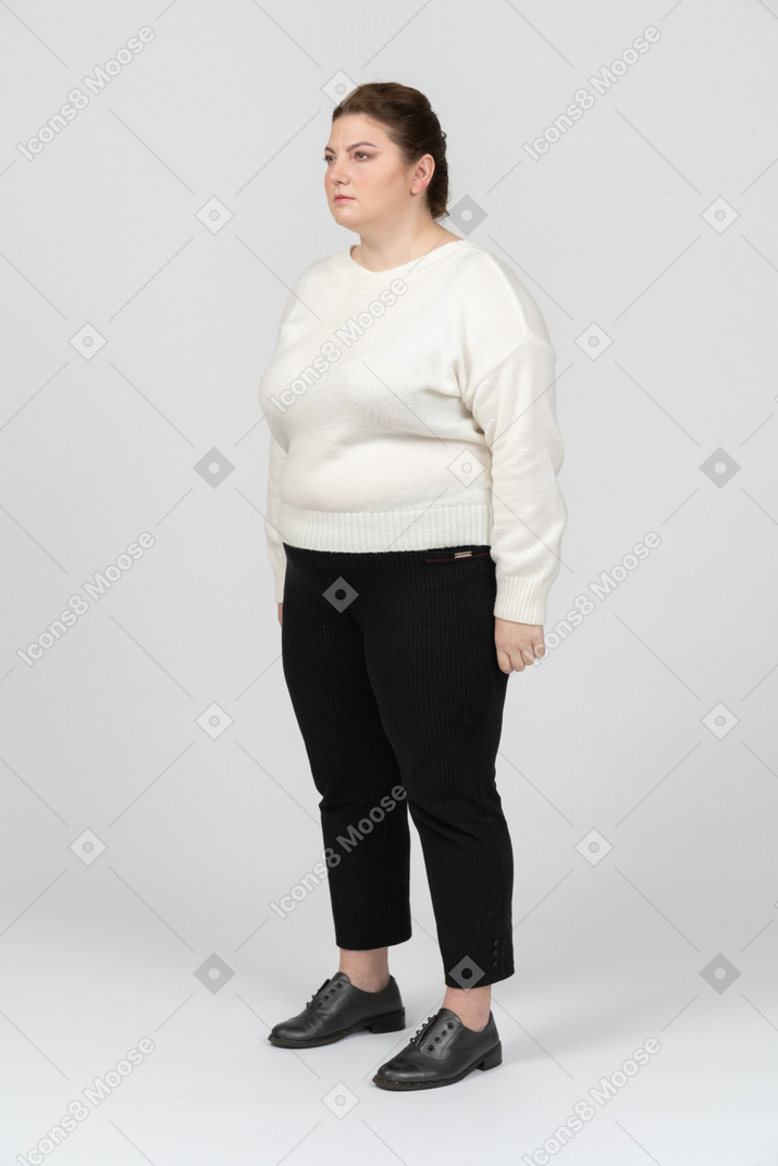 Plump woman in casual clothes standing